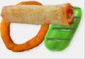 Fried egg roll, batter-coated onion ring, and grill-branded green pepper